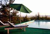 Montego Bay Beach Village Resort,Montego Bay Beach Village - luxury tents,log cabins,restaurant,beach house,Morjim,goa.